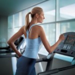 girl running on treadmill at gym