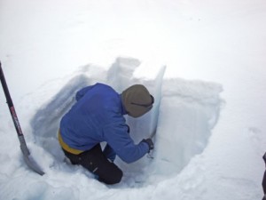 a man digs in snow