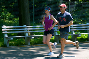A man and women jogging.