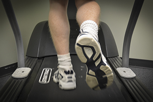 Man running on cushioned deck treadmill